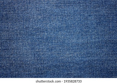 Blue jeans fabric background texture. Close up view. - Shutterstock ID 1935828733