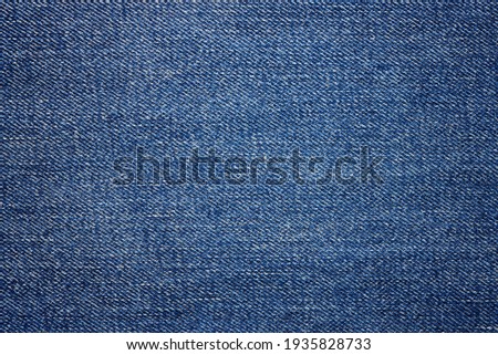 Blue jeans fabric background texture. Close up view.