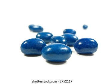 Blue Jelly Beans In A Pile On White.