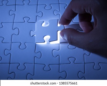 Blue jigsaw puzzle. Business solutions, solving problems,science technology and team building concept. - Shutterstock ID 1385575661