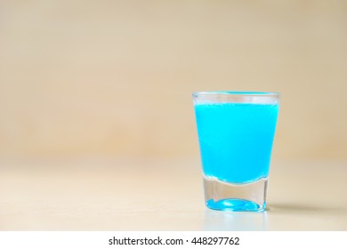 Blue kamikaze cocktail on wooden background