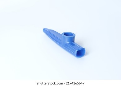 Blue Kazoo, Kazoo Isolated On A White Background. Wind Instrument Idea Concept. A Small Plastic Musical Instrument For Children. Copy Space, Nobody, No People. Music Education