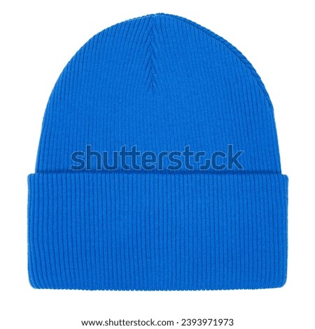 Blue knitted bobble hat isolated on white background