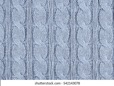 blue knitted textured background with a pattern closeup