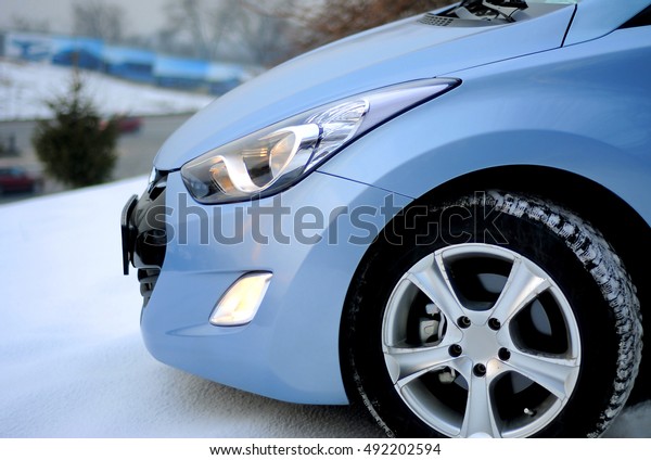 Blue korean car\
on the winter background\
snow