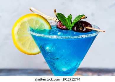 Blue Lagoon cocktail of blue curacao syrup mixed with vodka and lemonade