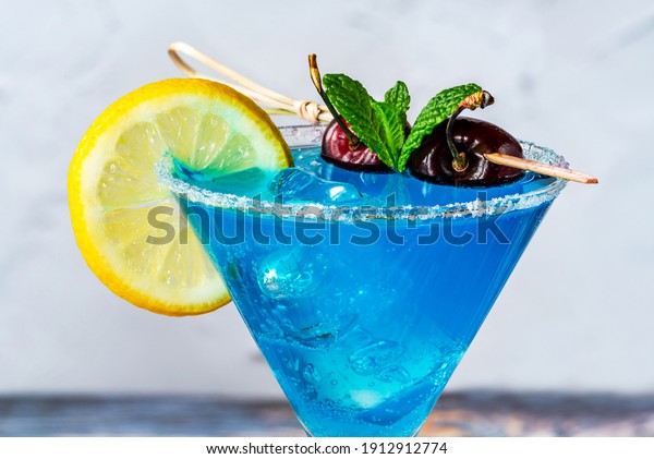 Blue Lagoon cocktail of blue curacao syrup mixed\
with vodka and lemonade