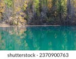 Blue Lake, the source of the Red Key in Bashkortostan, deciduous and coniferous trees around it.