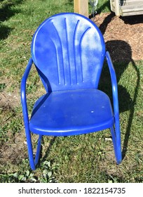 Blue Lawn Chair In A Yard