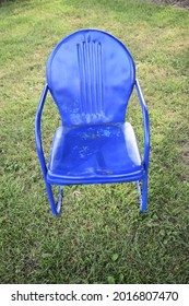 Blue Lawn Chair In A Yard