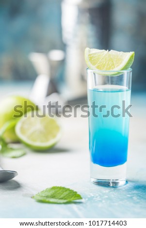 A blue layer alcoholic cocktail
