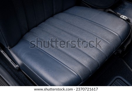 Blue leather passenger seat inside a car