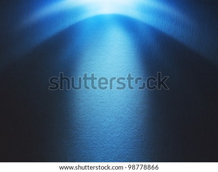 Blue light beam hitting at the rough surface with copy space