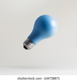 Blue light bulbs floating in the air
