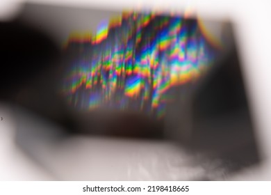 Blue Light Flare Prism Rainbow Flares Overlay Effect On Black Background, Light Crossing Crystals, Prismatic Sun Catcher Reflections Rays. Abstract Blurred Colourful Lens Flare Bokeh On Dark Backdrop