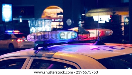 Blue light flasher atop of a police car