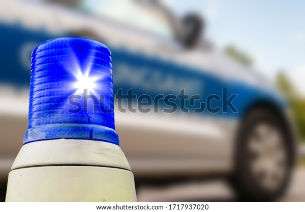 Blue light from the\
German police car