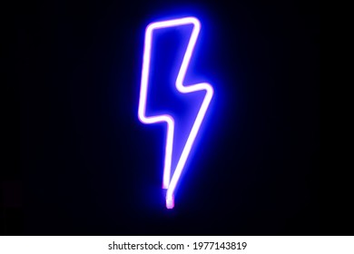Blue lightning bolt mounted neon signs. High-voltage neon symbol, light banner design element colorful modern design trends. Cyberpunk concept