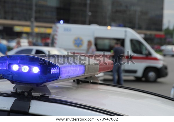 Blue lights of the police. The\
ambulance. Health care. Registration of a traffic\
accident.