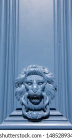 Blue lion shaped door knocker.