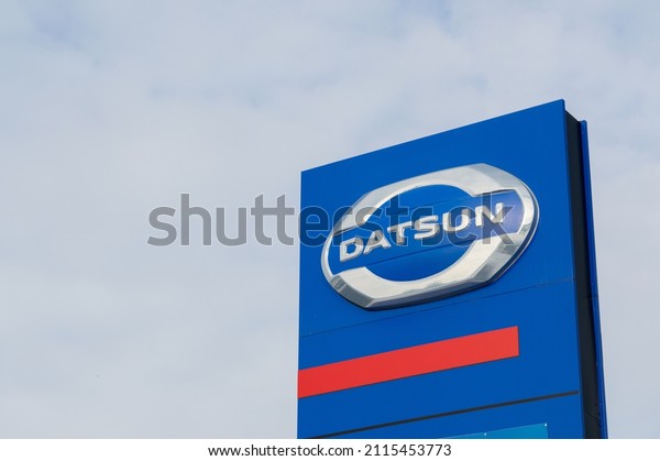 Blue logo of famous Japanese automotive company

Datsun, on blue sky background, left copy space. December 4,
2019, Belgorod, Russia