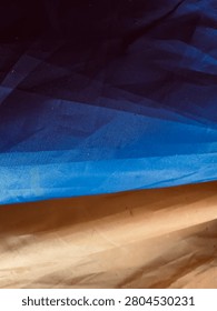 Blue Low Poly Abstract Background with Brown Geometric Landscape Texture