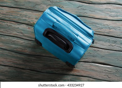 Blue Luggage Bag With Handle. Top View Of A Suitcase. Things Are Packed. Few Hours Before Departure.