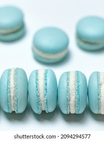 Blue Macaron Or Macaroon On White Background From Above, Colorful Almond Cookies, Pastel Colors, Top View.