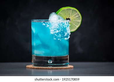 Blue Margarita On The Rocks With Salted Rim And A Lime Wheel