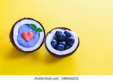 Blue Matcha Smoothie With Berries And Fruits In A Coconut.