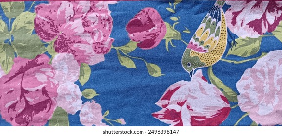a blue material flowered with a bird