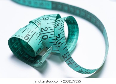 Blue measuring tape isolated on white background.
