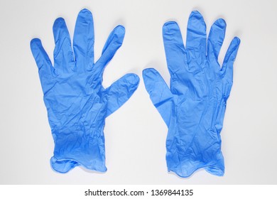 Blue Medical Gloves. Latex Sterile Gloves Lie On A White Background. There Are No People.