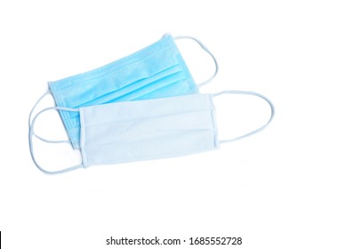 Blue Medical Mask Or Surgical Face Mask With Non Medical Cloth Mask To Prevent From Covid19 Or Coronavirus Infection On White Background