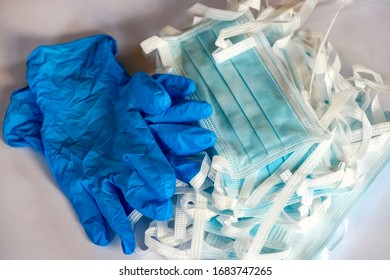 Blue medical protective masks with a carbon filter adn blue protective gloves. - Shutterstock ID 1683747265