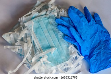 Blue medical protective masks with a carbon filter adn blue protective gloves. - Shutterstock ID 1686316795