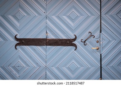 Blue, Medieval Wooden Door Texture Background. Rusty Lock And Handle, Vintage Metal Details On Beautiful, Geometric, Triangle Pattern. Old Building Entrance With Decorations. Close Up, Copy Space