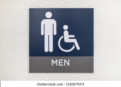 Blue Mens Bathroom Sign On A White Wall