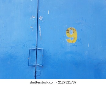 Blue Metal Door And Number Nine