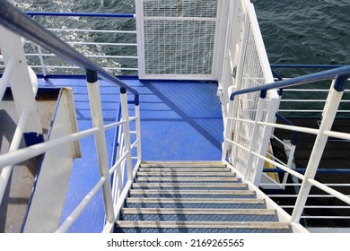 Blue Metal Stairs And White Wall Aboard Ship