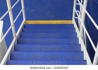 Blue Metal Stairs And White Wall Aboard Ship