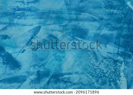 Blue modern abstract background. Texture blu Venetian plaster. Effects of drawing with a brush and trowel on the wall