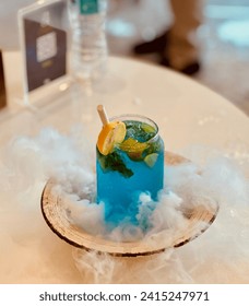 Blue mojitos are a vibrant twist on the classic cocktail, featuring the refreshing blend of muddled mint leaves, zesty lime, and crisp soda water.