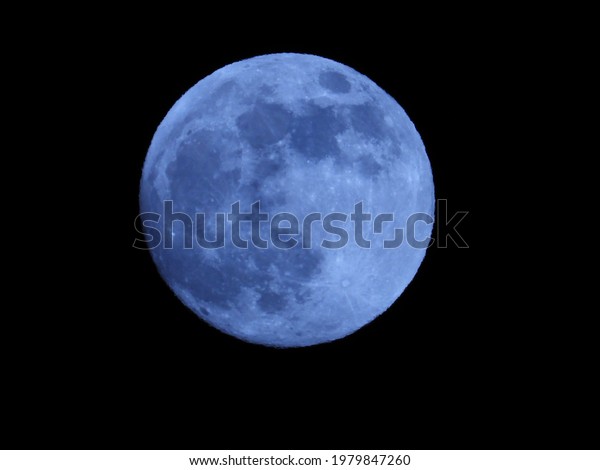 Blue moon in a cloudless\
sky