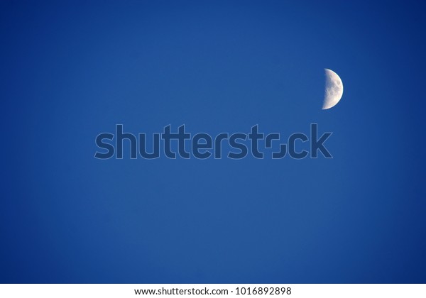 Blue Moon Craters. Super moon Background. planetar\
satellite in Solar System lunar phase. illuminated Half Moon were\
NOT furnished by NASA. Crescent moon - astronomical body that\
orbits planet Earth