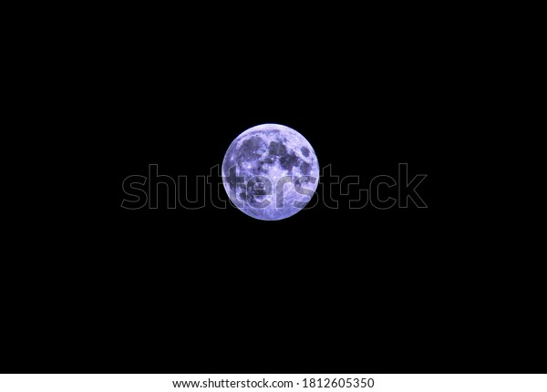 blue moon in the\
reflection of greenhouses