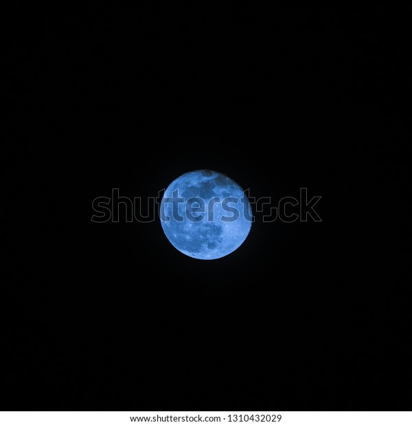 Blue moon sci-fi cinematic detailed\
photo through telescope of waning gibbous moon\
phase