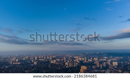 Blue morning skyscape panorama view in summer city residential district. Aerial cityscape above buildings and streets, Kharkiv Ukraine
