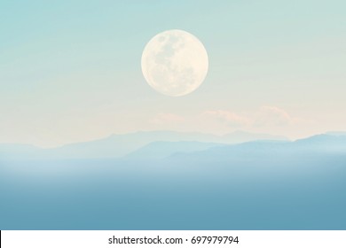 Blue Mountain With A Full Moon And Pastel Sky.  