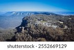 The Blue Mountains are a mountainous region and a mountain range located in New South Wales, Australia. The region is considered to be part of the western outskirts of the Greater Sydney area. 